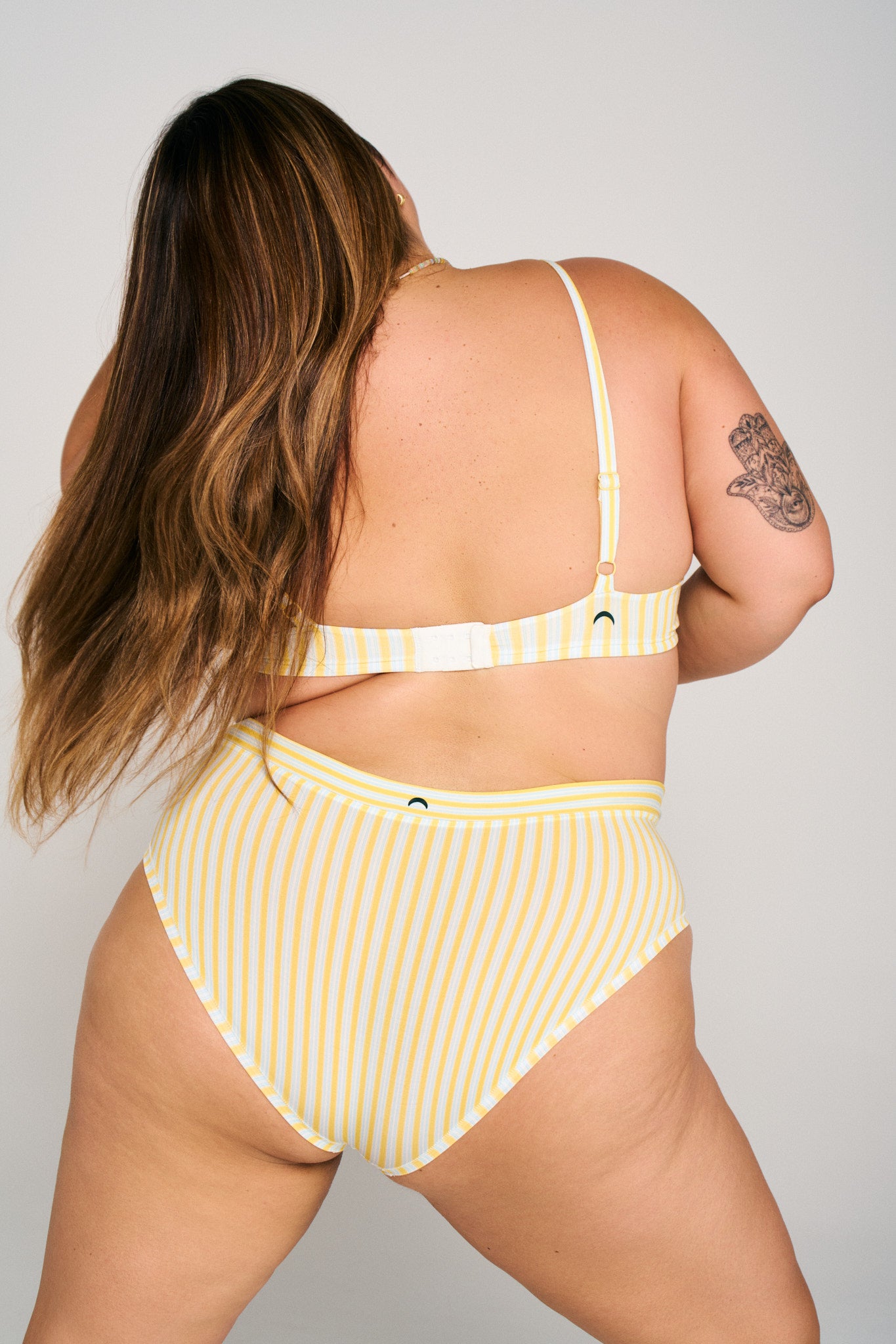 Riviera Stripe | Model is wearing size 2XL undie & XL bra
