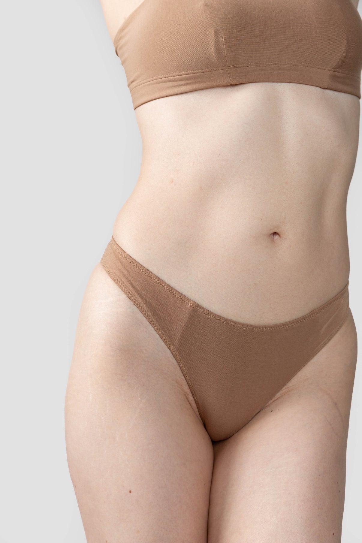 Tan | Model is wearing size M